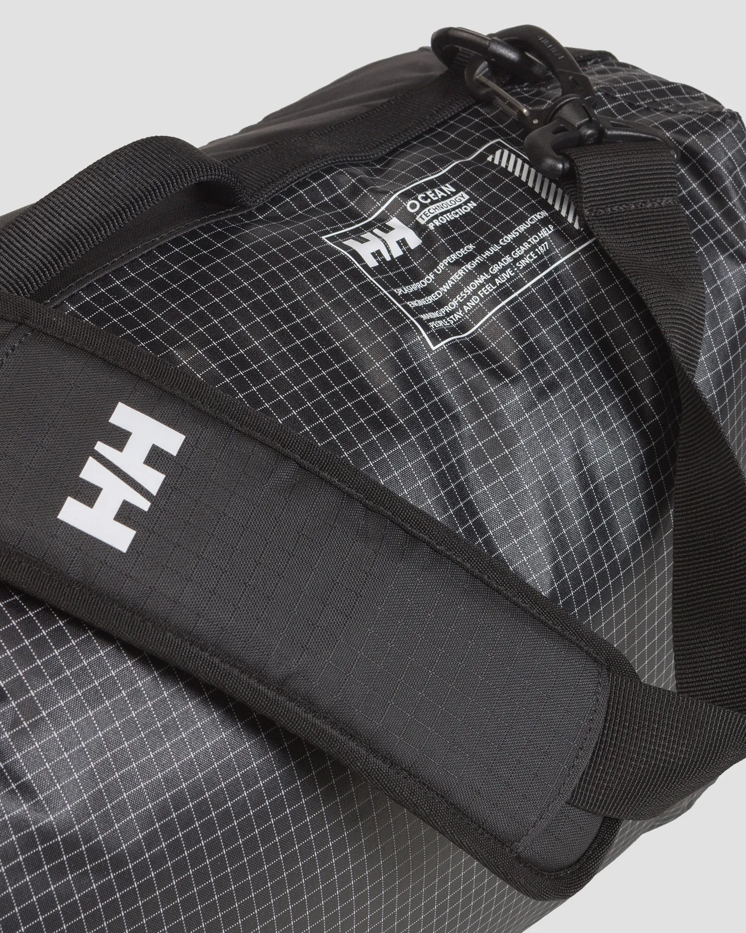 Black waterproof jacket bag  Helly Hansen Hightide WP Duffel 35L 67502-990