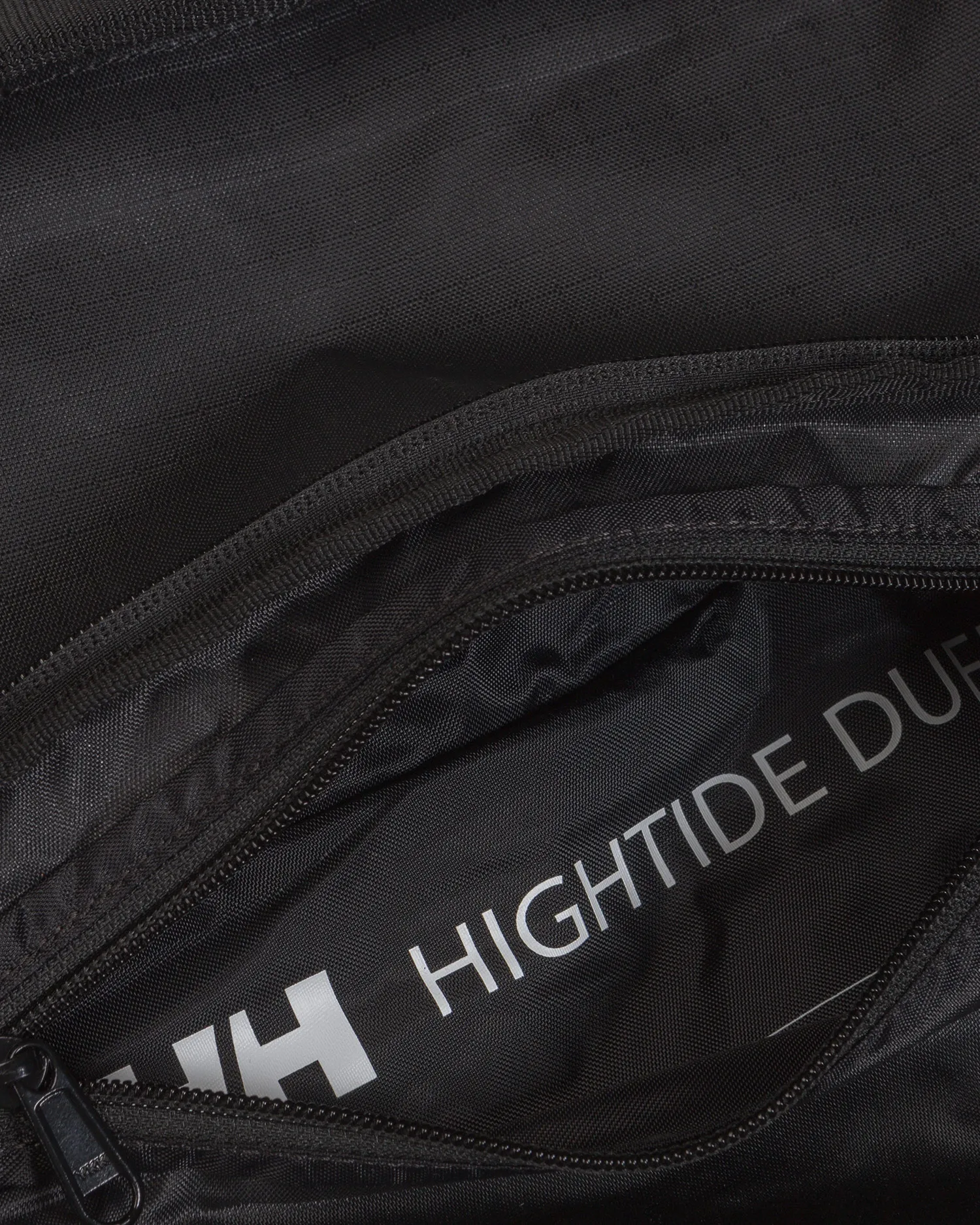 Black waterproof jacket bag  Helly Hansen Hightide WP Duffel 35L 67502-990